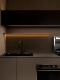 modern kitchen with sleek cabinetry and under-cabinet lighting, featuring a minimalist design; showcasing interior decor optimization using Homestyler's real-time 3D rendering feature.