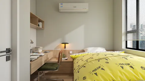 Cozy bedroom featuring a yellow patterned comforter and a study area with a desk and lamp, designed in a modern style to optimize space for small apartments, utilizing Homestyler's real-time 3D rendering feature for a quick design preview.