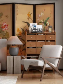 Wooden wardrobe displaying decorative items with a stylish armchair in a well-decorated living room, focusing on interior decor aesthetics, utilizing Homestyler's real-time 3D rendering feature.