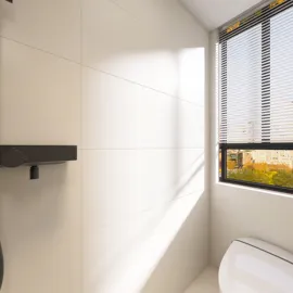 Modern bathroom featuring a wall-mounted toilet and large window, utilizing Homestyler's real-time 3D rendering for an immersive design preview.