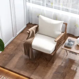 A cozy armchair with a blanket draped over it, featuring a modern design style and enhancing the comfort of a living room space, showcasing Homestyler's real-time 3D rendering functionality.